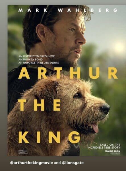 Man and dog on movie poster outdoors.