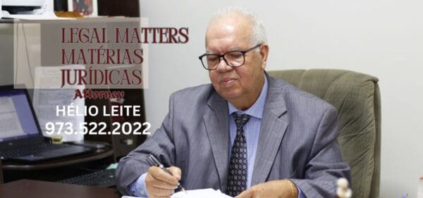Man in office suit writing at desk.