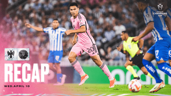 Soccer match action, pink and blue uniforms.