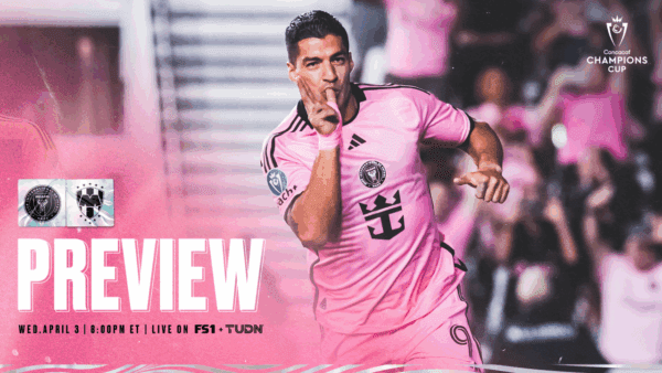 Soccer player celebrating in pink uniform.