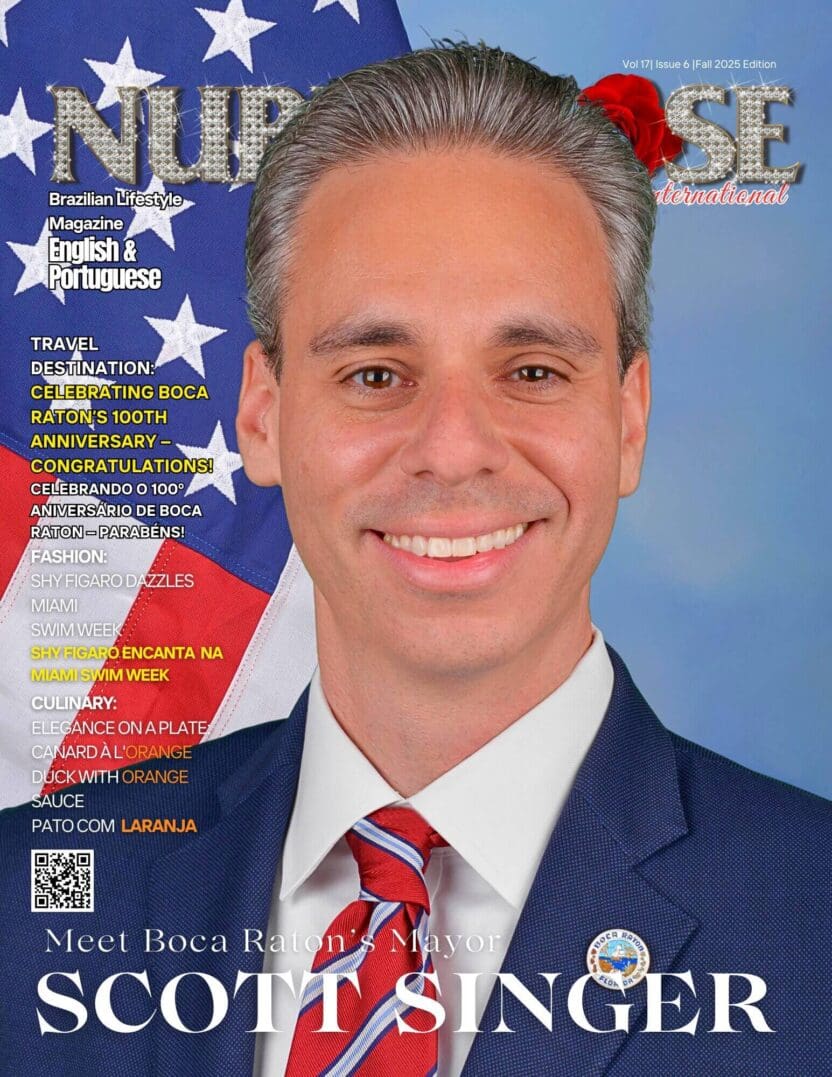 Professional portrait of a man in a suit with an American flag background.
