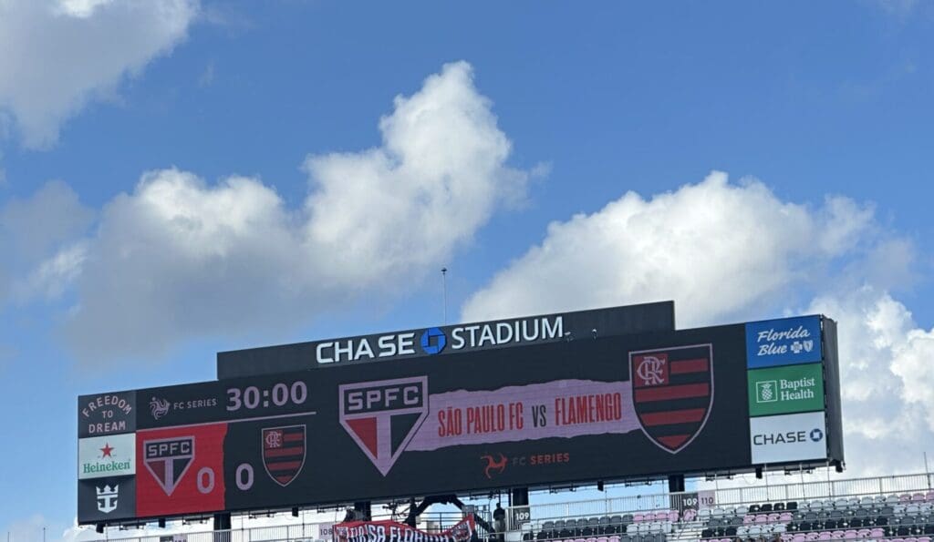 Scoreboard showing a 1-0 win for SPFC under clear blue sky at Chase Stadium.