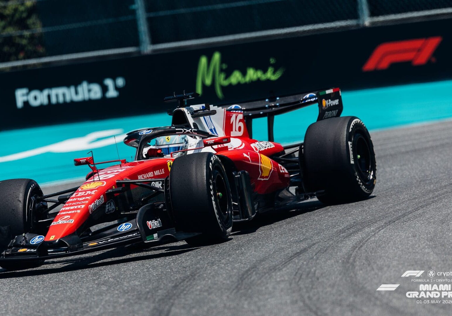 Red Ferrari F1 car cornering on track