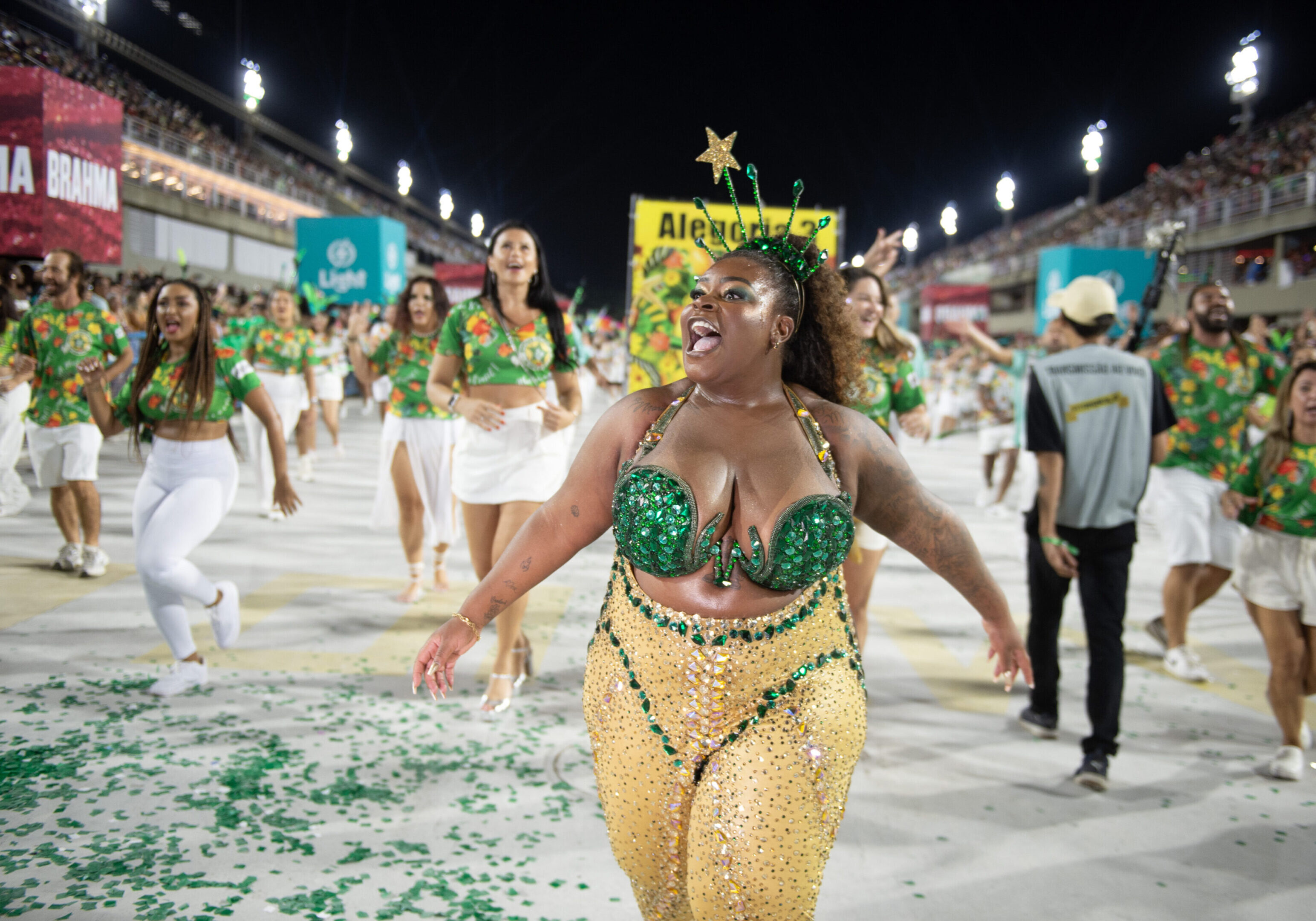 Carnival parade with dancers in colorful costumes.