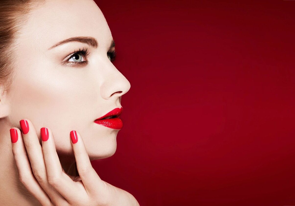 Profile of woman with red lipstick.