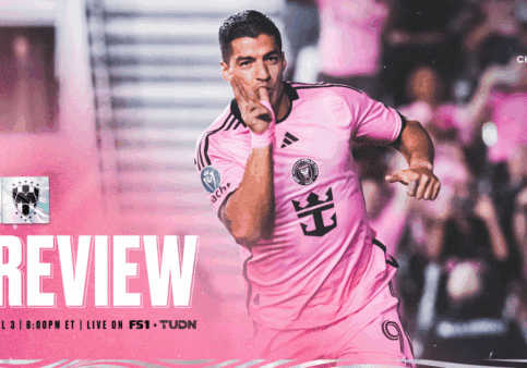 Soccer player celebrating in pink uniform.